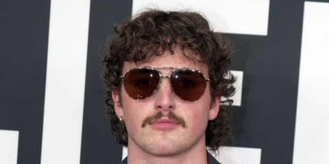 Benson Boone wears Dolce&Gabbana DG2302 02/53 gold sunglasses at the 67th Annual Grammy Awards - buy online.