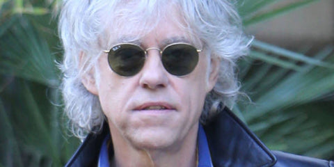Irish singer and activist Bob Geldof was seen wearing gold Ray-Ban Round Metal RB 3447 001/58 sunglasses with green polarised lenses in 2014. Shop online now on Pretavoir