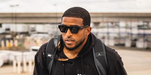 American football player Bobby Wagner of Washington Commanders was seen wearing black Prada PR A06S 16K08Z square sunglasses in his Instagram post, November 2024.