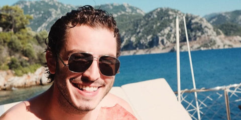 Turkish actor Boran Kuzum was seen wearing silver Saint Laurent Sun SL 653 Leon 001 aviator sunglasses in his Instagram post, July 2025.