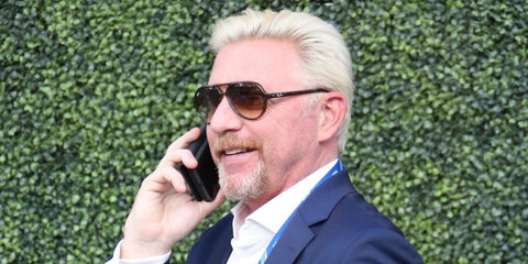 German tennis legend Boris Becker was seen wearing tortoiseshell Ray-Ban Cats 5000 RB 4125 710/51 sunglasses at the 2018 US Open 