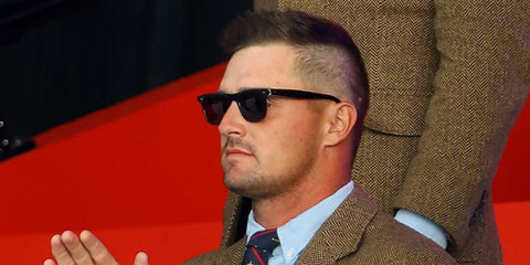 Professional golfer Bryson DeChambeau was seen wearing black Garrett Leight Wavecrest 2075 BKLCY/SFBK PLR Polarised sunglasses at the 43rd Ryder Cup opening ceremony.