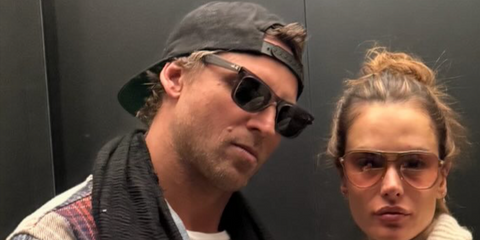 Jewelry designer Buck Palmer, pictured with supermodel girlfriend Alessandra Ambrosio, was seen wearing transparent grey Ray-Ban Wayfarer RB 2140 6773/R5 sunglasses in his Instagram post, February 2026.