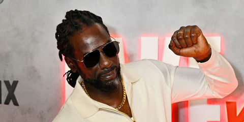 Jamaican reggae musician Buju Banton was seen wearing Tom Ford Jaden TF1017 28A sunglasses at the Jake Paul vs Anthony Joshua Netflix Live Event in Miami, December 2025.