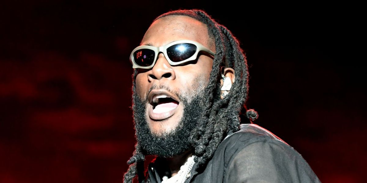 Burna Boy was seen wearing ruthenium Balenciaga BB0229S 002 sunglasses at the 2023 Dreamville Music festival in Raleigh, North Carolina