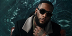 Burna Boy was seen modeling black Hugo Boss 1718/S 8071I square sunglasses in the Boss Fall/Winter 2024 eyewear campaign