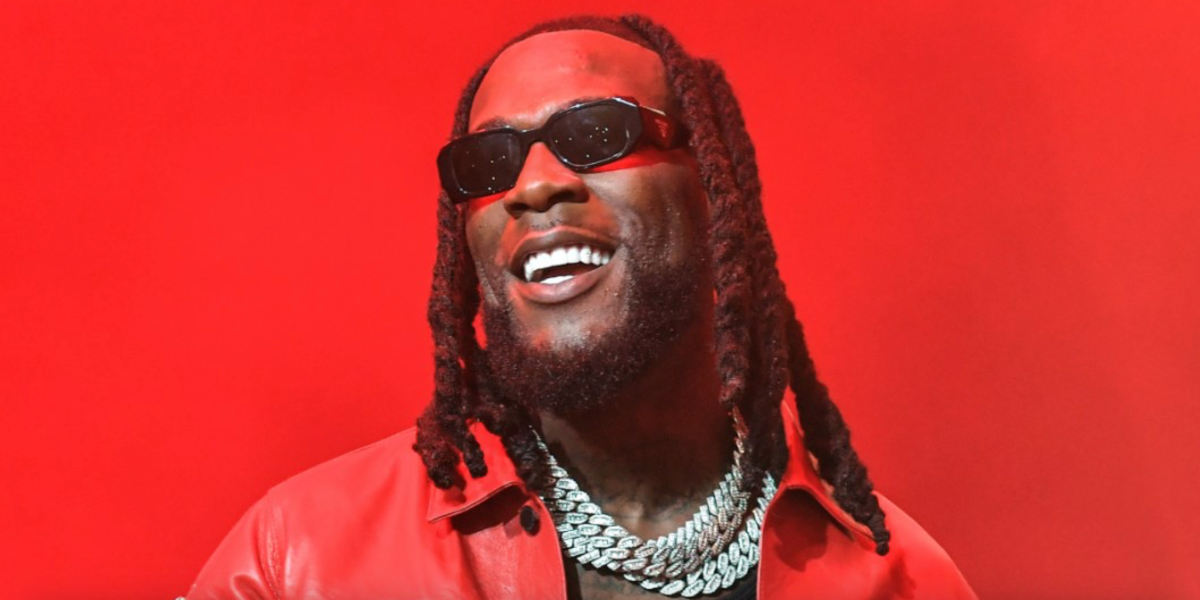 Burna Boy was seen wearing black Prada PR 17WS 1AB5S0 Symbole Sunglasses