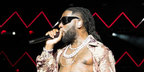 Burna Boy was seen wearing black Saint Laurent Sun Blaze SL M119 001 butterfly sunglasses at the Afro Nation Miami 2023 in Miami, Florida