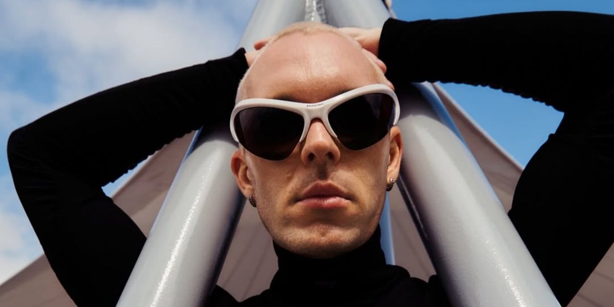 Creative director and drag artist CT Hedden was seen wearing white Balenciaga BB0232S 003 with Extending Sides sunglasses in his Instagram post, August 2025.