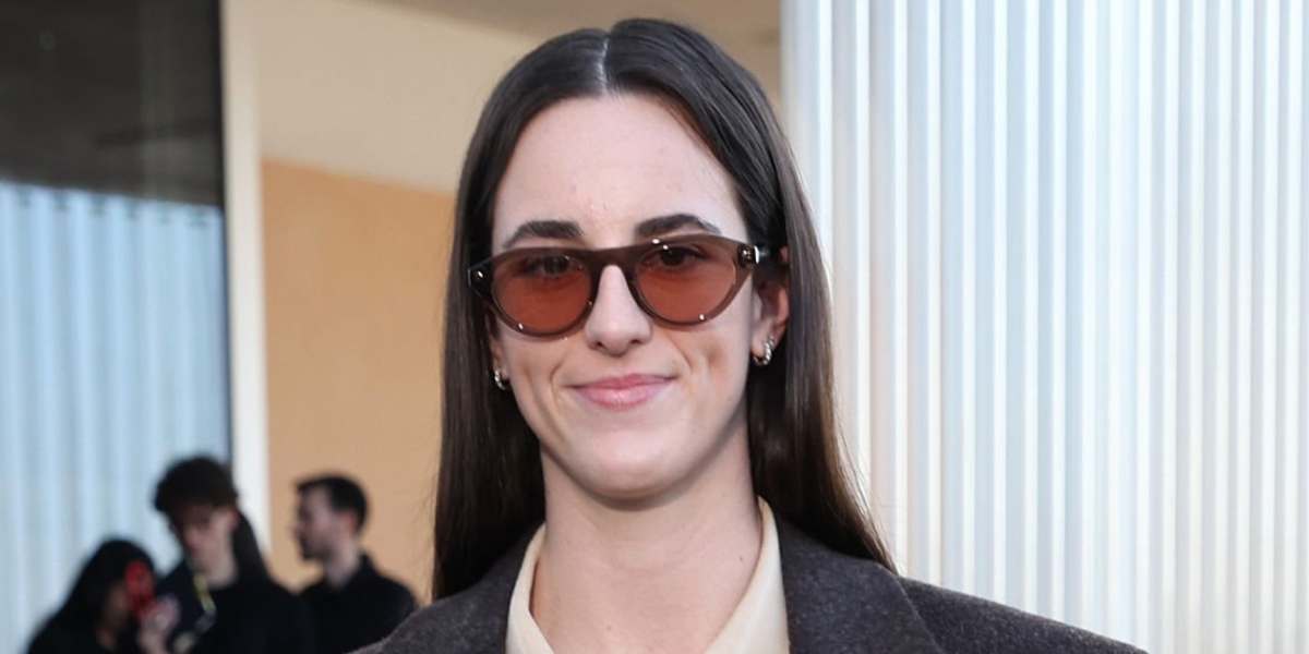 Professional basketball player Caitlin Clark  was seen wearing transparent clay Prada PR B15S 28I50W sunglasses with pink lenses at the Prada Fall/Winter 2026 fashion show during Milan Fashion Week.