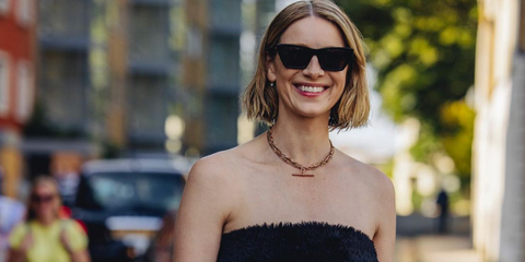 Caitriona Balfe was seen wearing black Saint Laurent Sun SL 276 Mica 001 cat eye sunglasses during London Fashion Week, September 2023