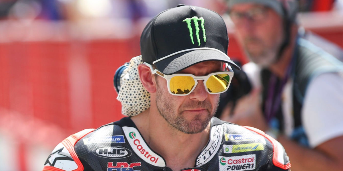 English motorcycle racer Cal Crutchlow was seen wearing matte white Oakley HSTN Sq OO9533 07 sunglasses with Prizm 24k Polarised lenses at the MotoGP of Italy, May 2026.