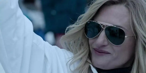 French actress Camille Cottin was seen wearing Ray-Ban Shooter RB 3138 001 aviator sunglasses in 2021 movie House of Gucci, as Paola Franchi