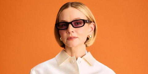 Carey Mulligan was seen wearing black Prada PR B06S 16K40J sunglasses with purple lenses at the Prada Spring/Summer 2026 fashion show during Milan Fashion Week. Shop online now on Pretavoir