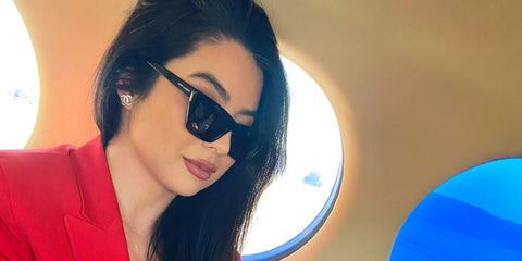 Actress Caroline Kwan was seen wearing black Saint Laurent Sun SL 276 Mica 001 sunglasses in her Instagram post, February 2022.