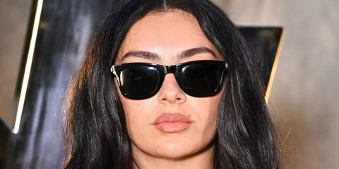 Charli XCX was seen wearing black Saint Laurent Sun SL 819 001 sunglasses at the Saint Laurent Spring/Summer 2026 fashion show during Paris Fashion Week. Shop online now on Pretavoir
