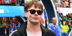 Charlie Heaton was seen wearing black Saint Laurent Sun SL 715 Slim 001 sunglasses at the World Cup 2026 semi final match between England and Argentina in Atlanta, Georgia.