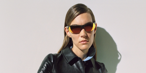 Canadian singer Charlotte Cardin was seen wearing metal khaki Miu Miu MU A02S 17Y5M0 sunglasses with orange mirror lenses in the Miu Miu Fall/Winter 2024 campaign.