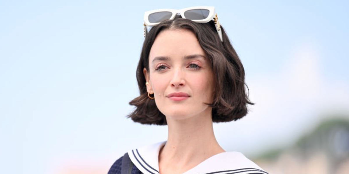 Charlotte Le Bon was seen wearing white Miu Miu MU 09WS 1425S0 cat eye sunglasses to the 2023 Cannes Film Festival
