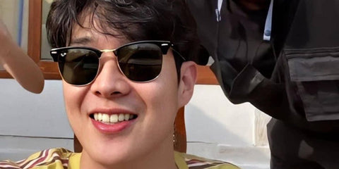 South Korean actor Choi Woo-shik was seen wearing the iconic Ray-Ban Clubmaster 3016 W0365 Black sunglasses.