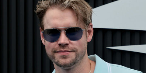 Glee actor Chord Overstreet was seen wearing silver Persol 1006S 518/56 aviator sunglasses with blue lenses at the US Open 2024. Shop online now on Pretavoir