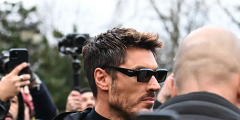 Chris Appleton was seen wearing black Prada PR 27ZS 16K08Z rectangular sunglasses outside the Schiaparelli Spring/Summer 2024 show during Paris Haute Couture Week