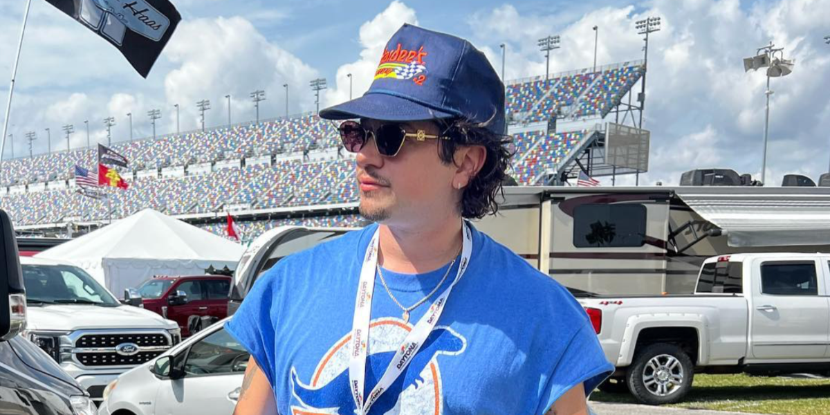 Actor Chris Galya was seen wearing gold Loewe Metal LW40115U 30Y sunglasses with purple lenses at the Daytona International Speedway for a NASCAR race in February 2024.