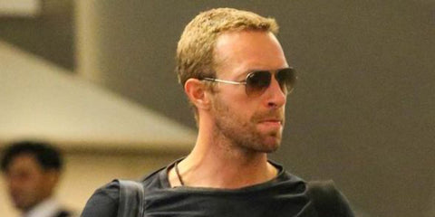 Coldplay frontman Chris Martin was seen wearing Ray-Ban Aviator 3025 004/51 Grey/Brown Gradient sunglasses