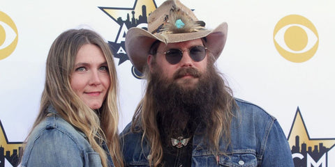 Chris Stapleton was seen wearing rose gold Ray-Ban Round Metal RB 3447 9202/B1 sunglasses with grey lenses