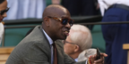 British journalist and presenter Clive Myrie was seen wearing brown Persol Vincent 3373S 96/56 sunglasses with blue lenses at the Wimbledon Tennis Championships 2025. Shop online now on Pretavoir