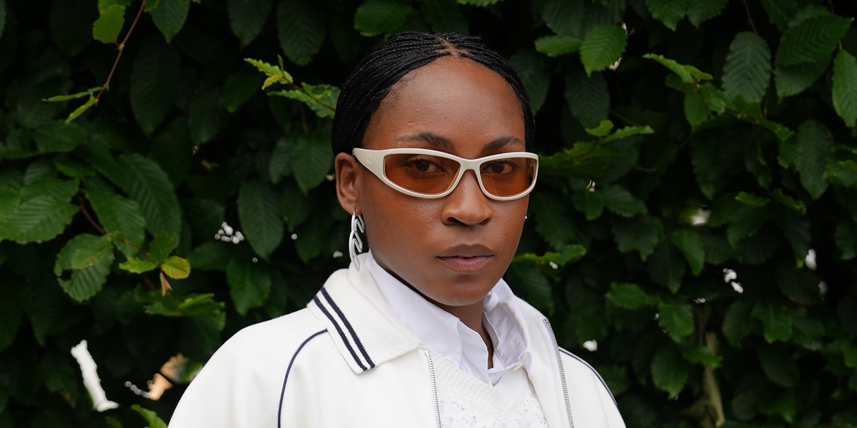 Tennis player Coco Gauff wore white Miu Miu MU C06SU 21D90X sunglasses with orange lenses in the Miu Miu Tennis Club campaign.