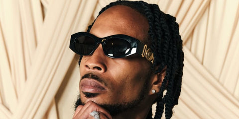 DJ and record producer D Double E was seen wearing black Versace 4480U GB1/87 sunglasses at the MOBO Awards 2026 in Manchester.