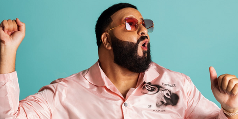 DJ Khaled was seen wearing gold Cartier CT0007RS 001 square rimless sunglasses with pink red lenses in a fashion editorial page of GQ Magazine