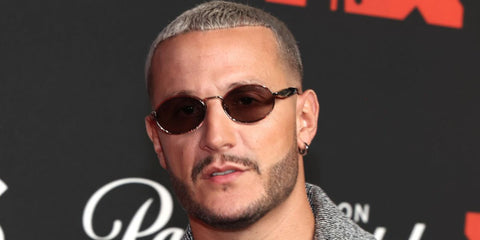 DJ Snake was seen wearing Prada PR 65ZS ZVN20I oval sunglasses at the MTV VMA 2025. Shop online now on Pretavoir