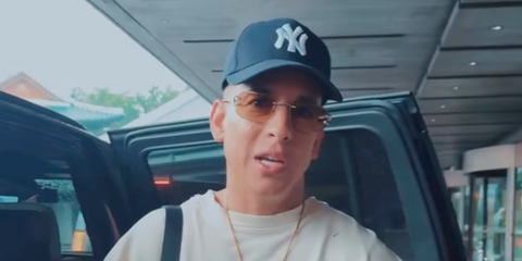 Daddy Yankee was seen wearing gold Cartier CT0468S 004 rimless sunglasses with brown lenses in Seoul, October 2025. Shop online now on Pretavoir
