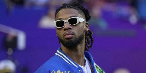 Damar Hamlin was seen wearing white talc Prada PR 17WS 1425S0 sunglasses to the Super Bowl 2023