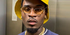 Television personality Dami Hope of Love Island (2022) was seen wearing gold Miu Miu MU 52YS ZVN10R sunglasses with yellow lenses in his Instagram post.