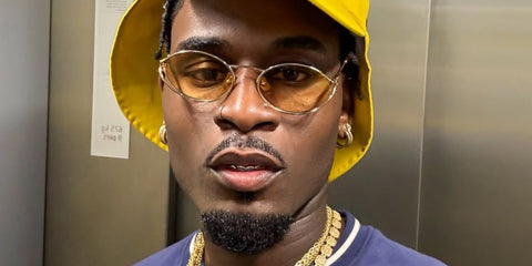 Television personality Dami Hope of Love Island (2022) was seen wearing gold Miu Miu MU 52YS ZVN10R sunglasses with yellow lenses in his Instagram post.