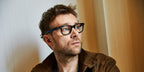 Musician Damon Albarn of Blur and Gorillaz was seen wearing black Ray-Ban Wayfarer Ease RB 4340V 2000 optical glasses. Shop online now on Pretavoir