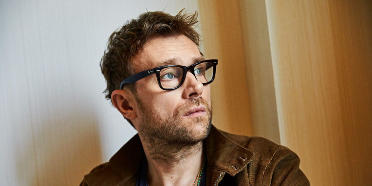 Musician Damon Albarn of Blur and Gorillaz was seen wearing black Ray-Ban Wayfarer Ease RB 4340V 2000 optical glasses. Shop online now on Pretavoir