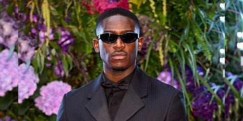 Damson Idris was seen wearing Prada PR 26ZS 16K08Z cat eye sunglasses to attend Stormzy's birthday party "The Mike Gala"