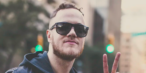 Dan Reynolds of Imagine Dragons was seen wearing black Ray-Ban Boyfriend RB 4147 601/87 sunglasses, photographed by Trish Badger.