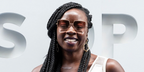 Actress Danai Gurira was seen wearing gold Burberry Daphne BE3133 1337/13 oversized square sunglasses with pink-brown gradient lenses at the US Open 2026.