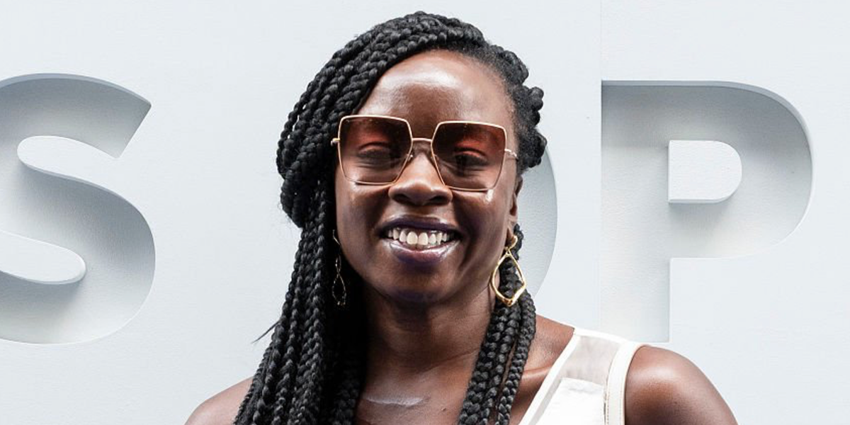 Actress Danai Gurira was seen wearing gold Burberry Daphne BE3133 1337/13 oversized square sunglasses with pink-brown gradient lenses at the US Open 2026.