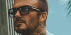 David Beckham was seen wearing brown David Beckham DB 7159/S 09QSD sunglasses with blue Photochromic lenses in the David Beckham Eyewear Spring 2026 campaign.