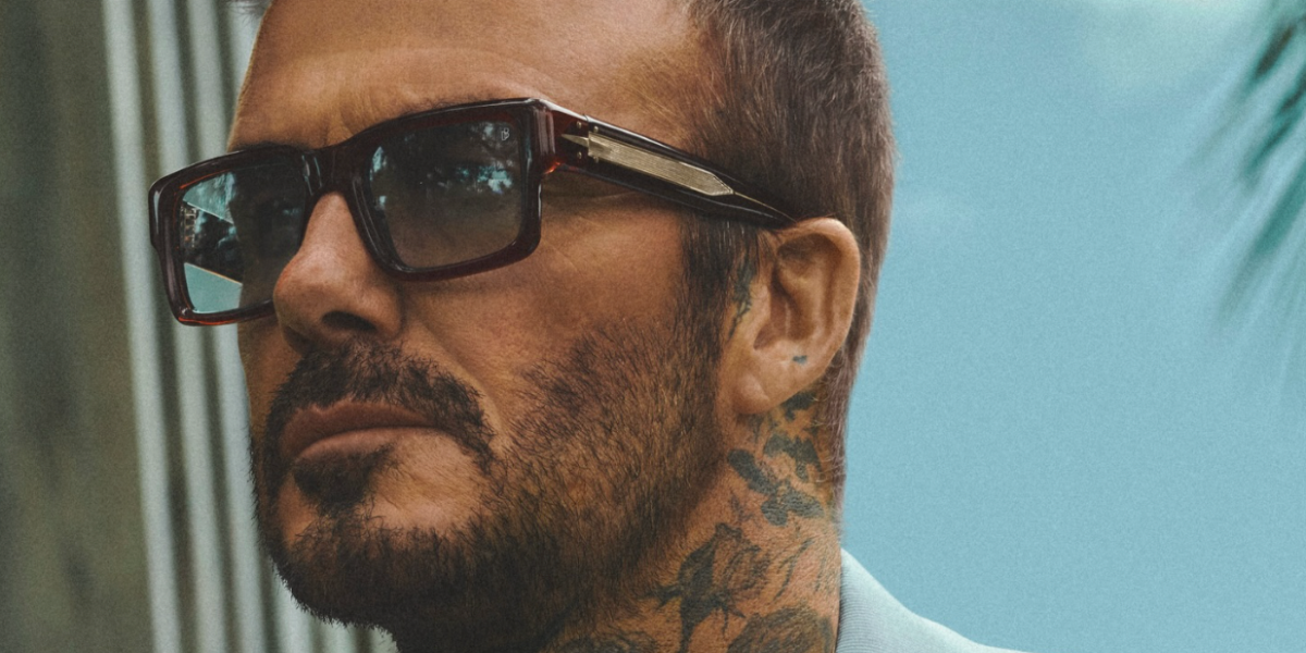 David Beckham was seen wearing brown David Beckham DB 7159/S 09QSD sunglasses with blue Photochromic lenses in the David Beckham Eyewear Spring 2026 campaign.