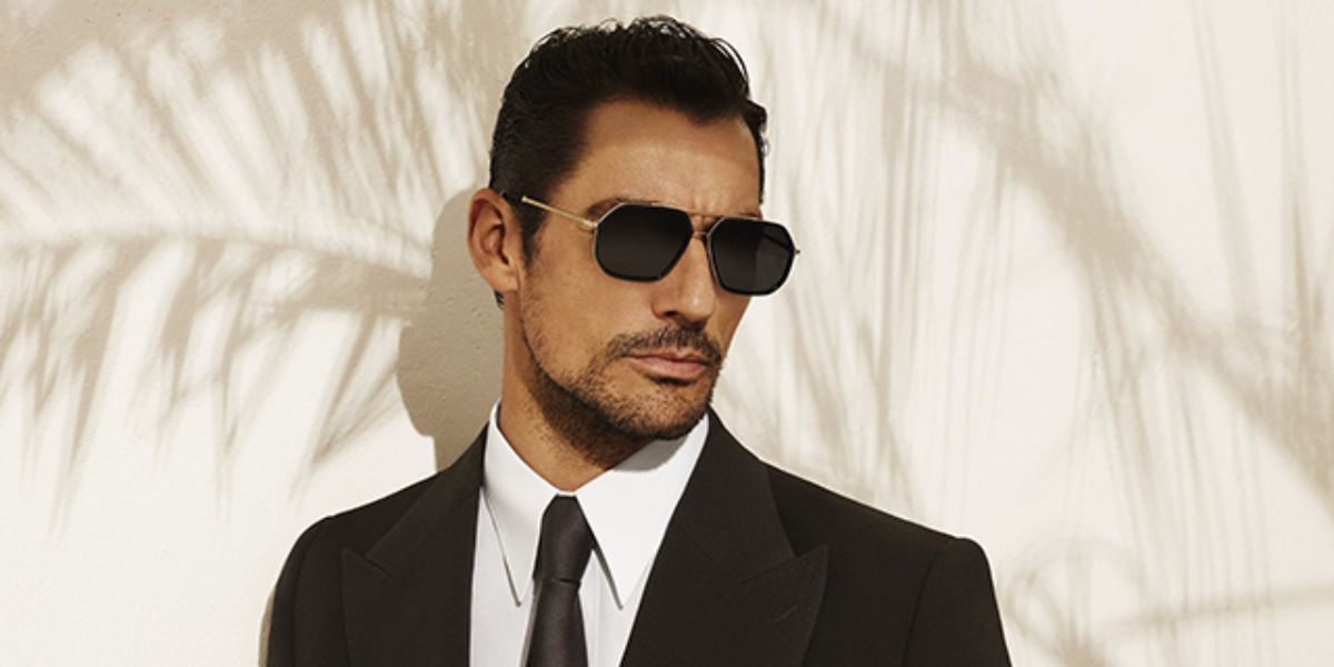 David Gandy was seen modeling gold and black Dolce&Gabbana DG2285 02/81 Polarised aviator sunglasses in Dolce & Gabbana Eyewear Spring/Summer 2022 campaign