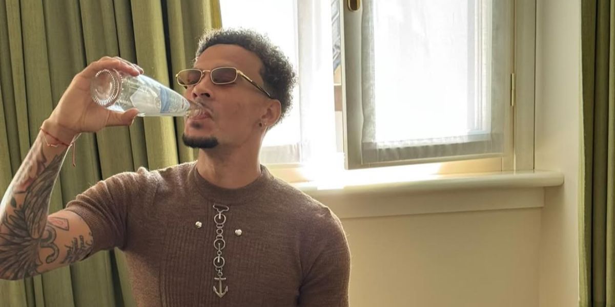 Footballer Dele Alli was seen wearing gold and tortoiseshell Prada PR B54S 5AK50P rectangular sunglasses with brown lenses during Milan Men's Fashion Week season Spring/Summer 2026. Shop online now on Pretavoir
