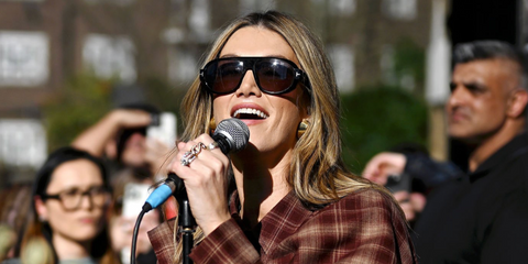 Australian singer-songwriter Delta Goodrem was seen wearing black Tom Ford Blake-02 TF1102 01A sunglasses during a surprise performance ahead of Eurovision in London, April 2026.