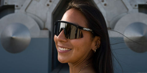 Mexican female quarterback Diana Flores was seen wearing black Oakley Hydra OO9229 01 Prizm sunglasses in an Oakley Media Hub gallery